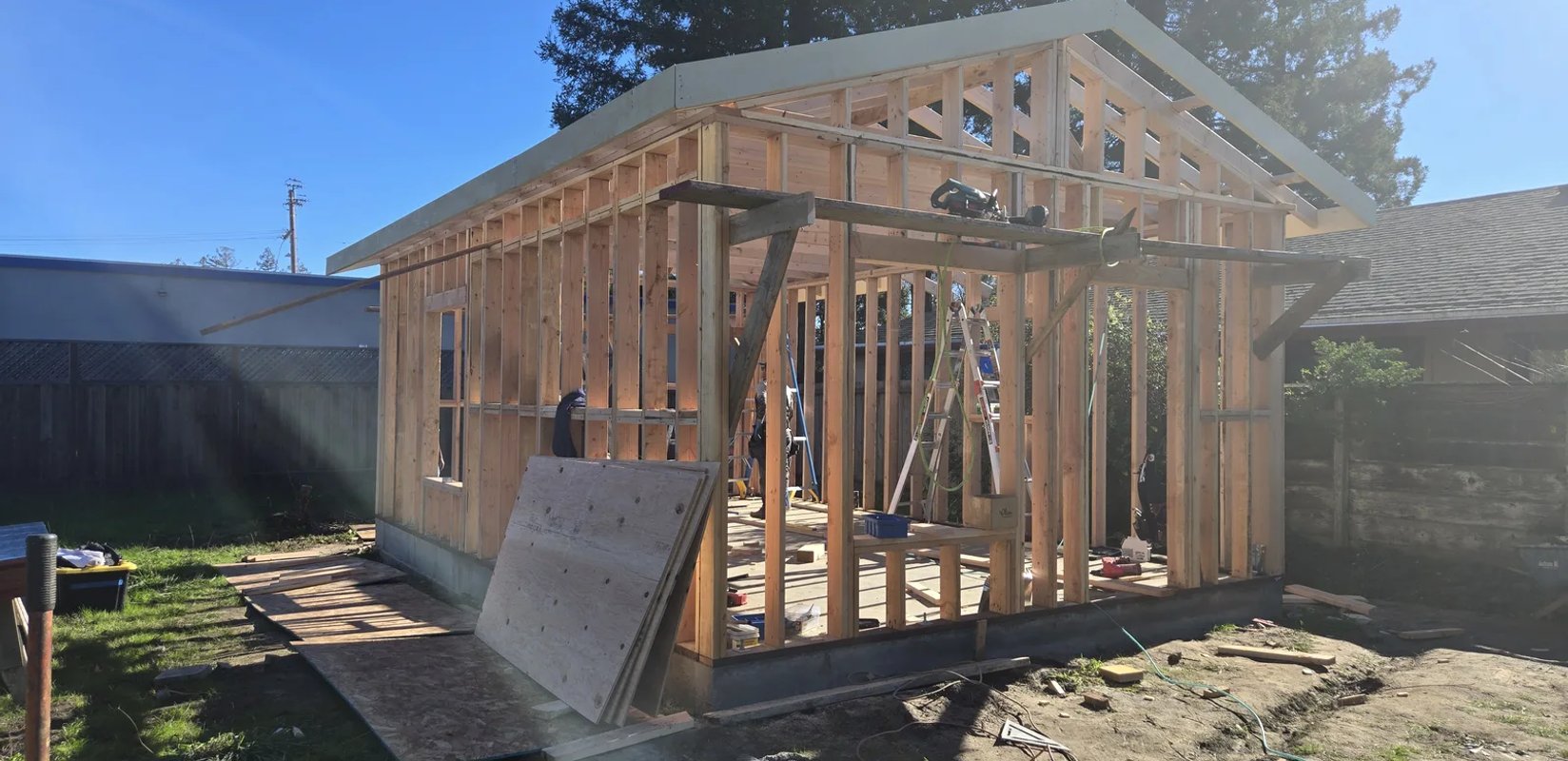 Wood wall and roof framing for a detached residential structure