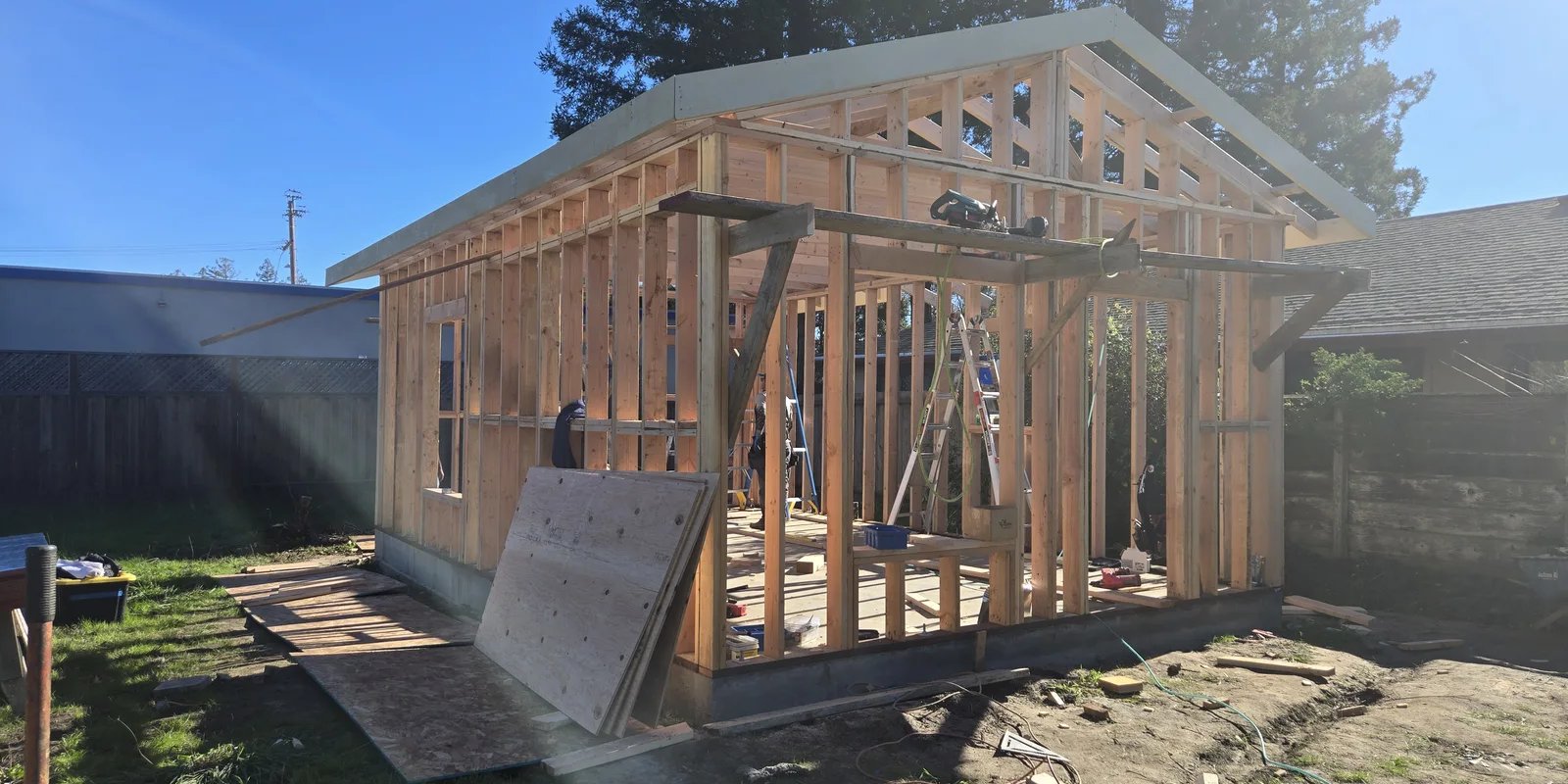 Wood wall and roof framing for a detached residential structure