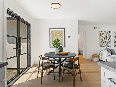 whole home remodel dining area with black framed doors
