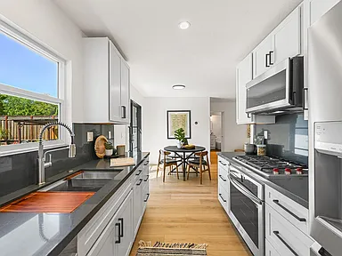 galley kitchen remodel with window over sink